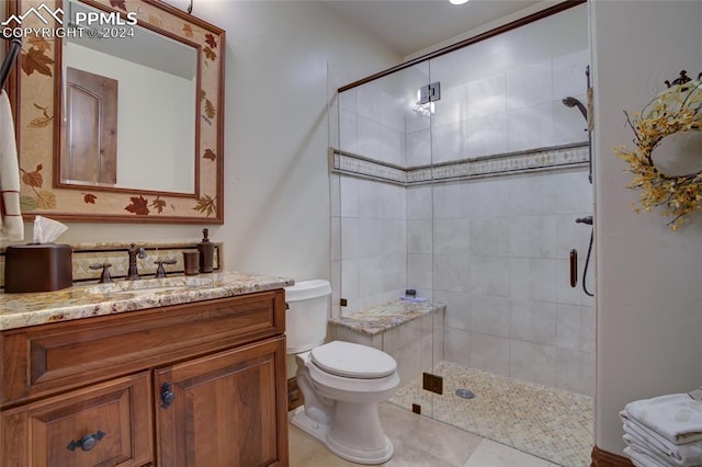 4950 Longwood Pt, Colorado Springs, CO 80906 - full bathroom featuring tile patterned flooring, tiled shower, vanity, and toilet