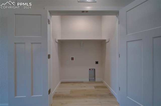 laundry room featuring light wood-type flooring, hookup for a washing machine, and hookup for an electric dryer