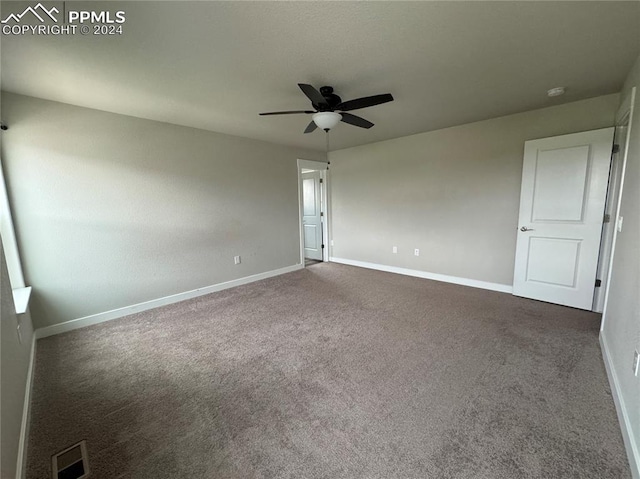 carpeted empty room with ceiling fan