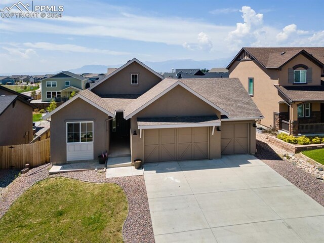 ranch-style house featuring a garage