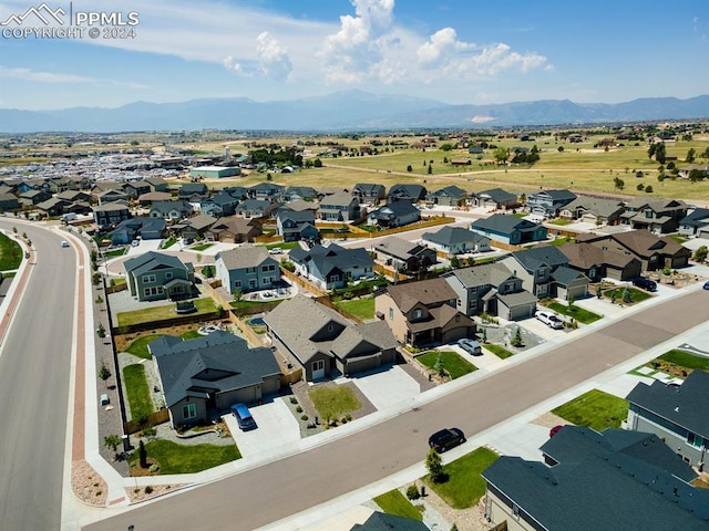 birds eye view of property featuring a mountain view