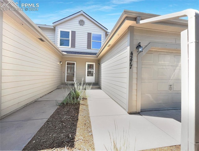 doorway to property featuring a garage