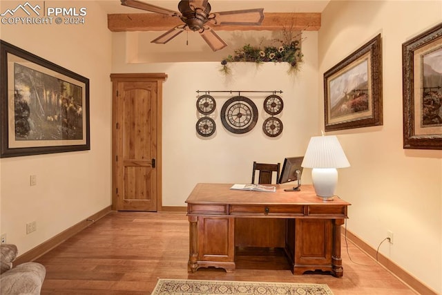 office space featuring ceiling fan, baseboards, and wood finished floors