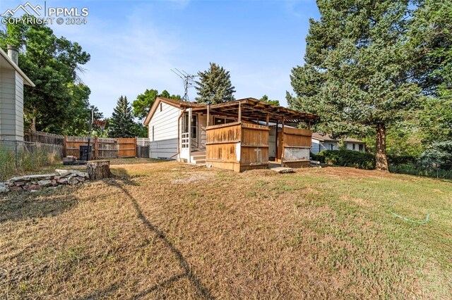 view of outdoor structure with a lawn