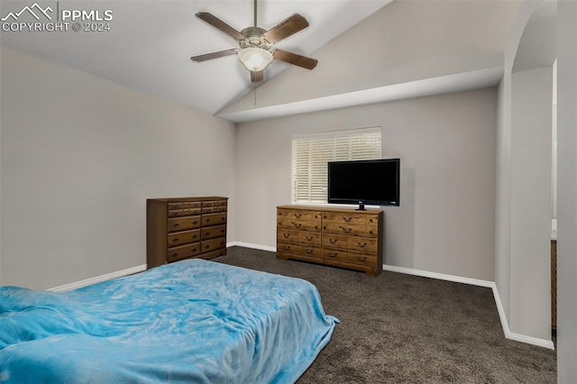 carpeted bedroom featuring ceiling fan and vaulted ceiling