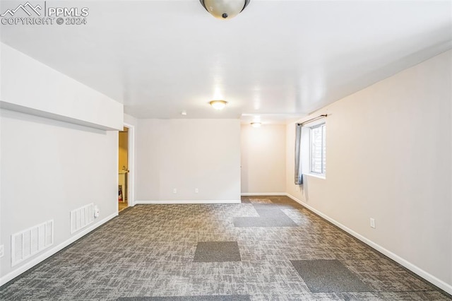 empty room featuring carpet flooring