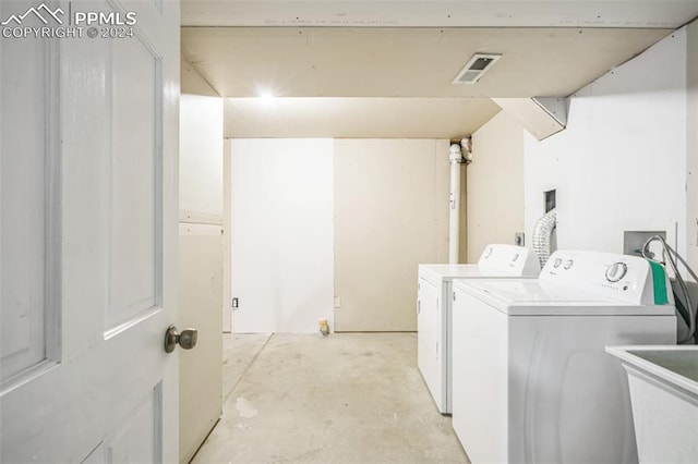 laundry room with sink and separate washer and dryer