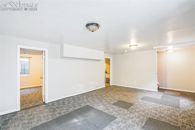 unfurnished room with carpet