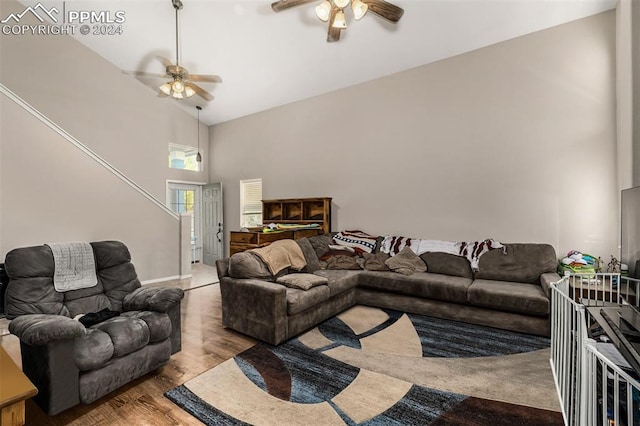 living room with high vaulted ceiling, light wood-type flooring, and ceiling fan