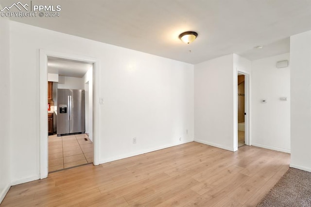 unfurnished room featuring light hardwood / wood-style floors