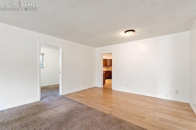 unfurnished room featuring light hardwood / wood-style floors