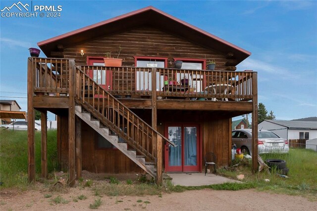 rear view of house with a deck