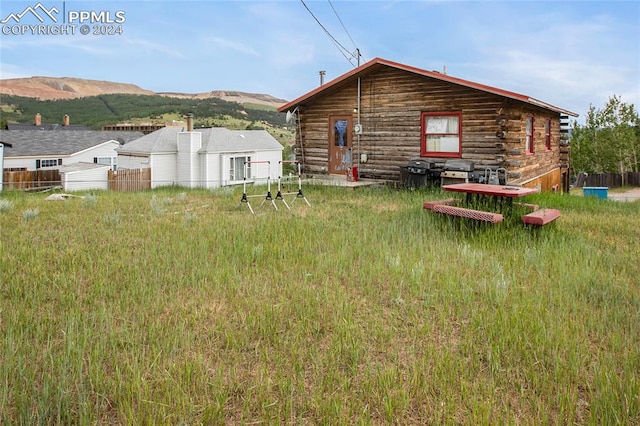 back of house featuring a mountain view