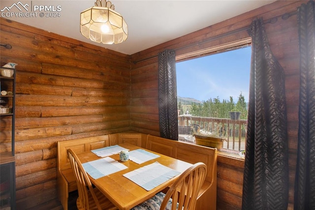 dining room with log walls