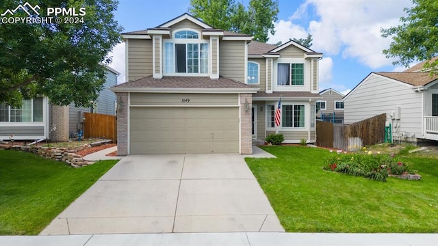 view of front of house with a garage and a front yard