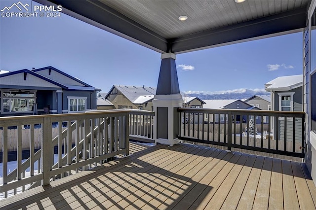 wooden deck featuring a mountain view