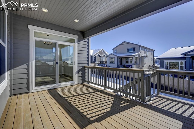 wooden deck with a residential view