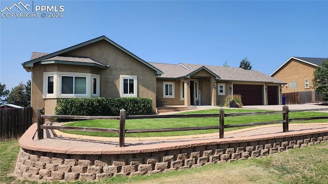 ranch-style home featuring a garage and a front lawn