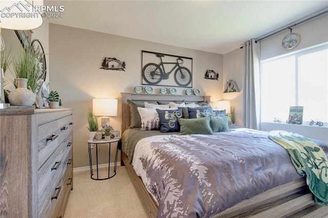 bedroom featuring light colored carpet