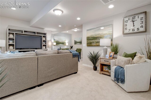 living room with light colored carpet