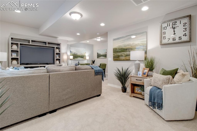 living room featuring carpet, visible vents, baseboards, and recessed lighting