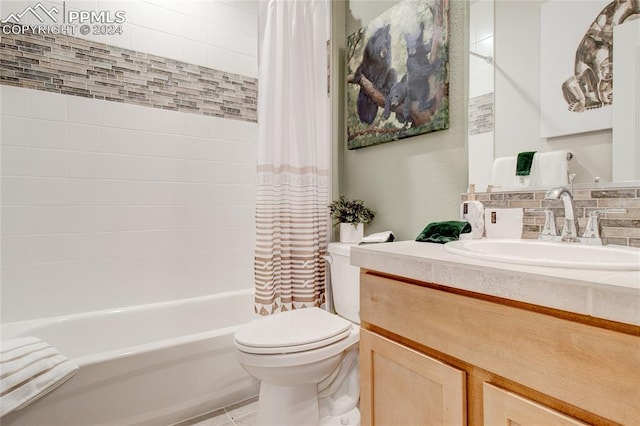 full bathroom with shower / bath combination with curtain, toilet, vanity, tile patterned floors, and decorative backsplash