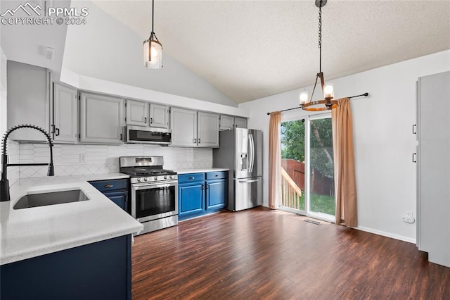 kitchen with decorative backsplash, sink, dark hardwood / wood-style flooring, appliances with stainless steel finishes, and a textured ceiling