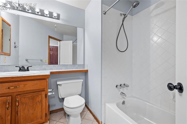 full bathroom with tile patterned floors, vanity, toilet, and tiled shower / bath combo