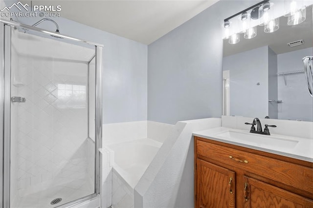 bathroom with vanity and plus walk in shower