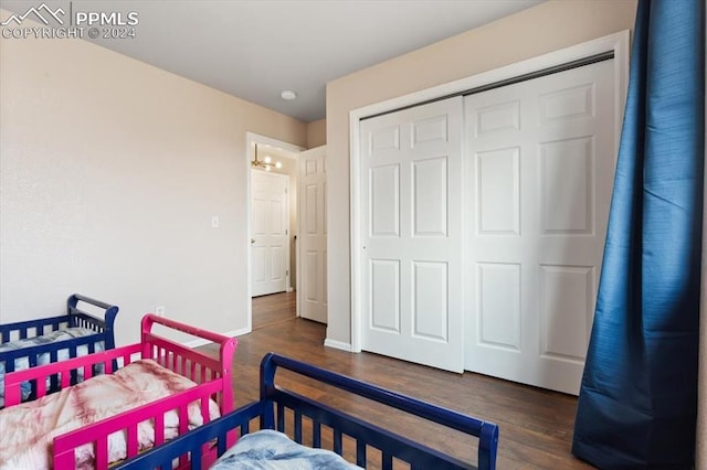 7848 Chasewood Loop, Colorado Springs, CO 80908 - bedroom with a closet, wood finished floors, and baseboards