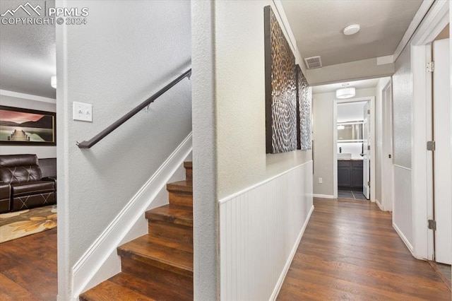 7848 Chasewood Loop, Colorado Springs, CO 80908 - corridor with visible vents, stairway, and wood finished floors