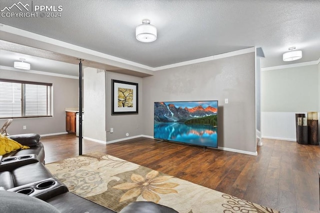 7848 Chasewood Loop, Colorado Springs, CO 80908 - living room with a textured ceiling, wood finished floors, crown molding, and baseboards
