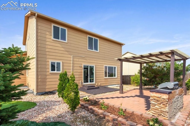 7848 Chasewood Loop, Colorado Springs, CO 80908 - rear view of property featuring a pergola, area for grilling, a patio, and fence