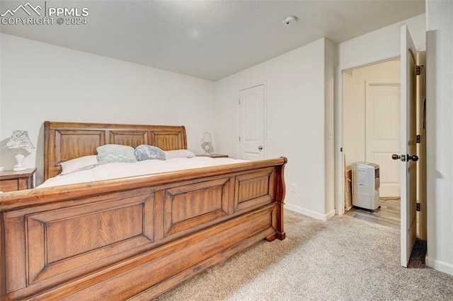 bedroom with light colored carpet