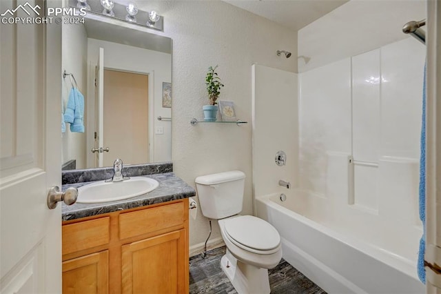 full bathroom featuring vanity, shower / bathing tub combination, and toilet