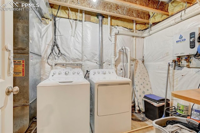 washroom with washing machine and clothes dryer