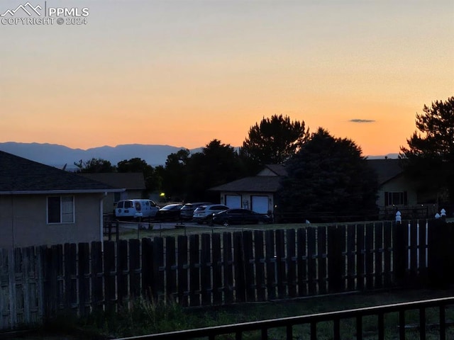 pool at dusk with a mountain view