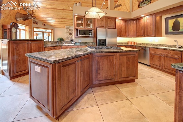 kitchen featuring sink, a center island, pendant lighting, wood ceiling, and appliances with stainless steel finishes