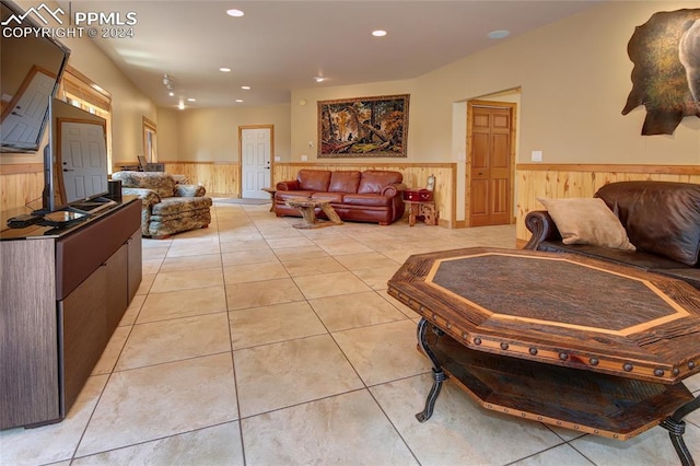 tiled living room with wooden walls