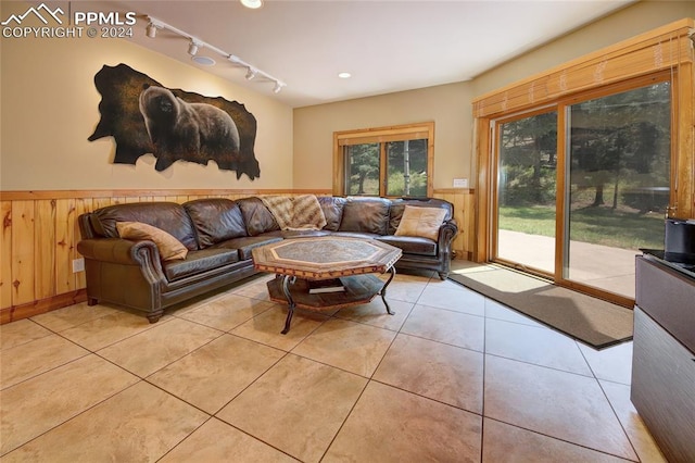 tiled living room with wood walls