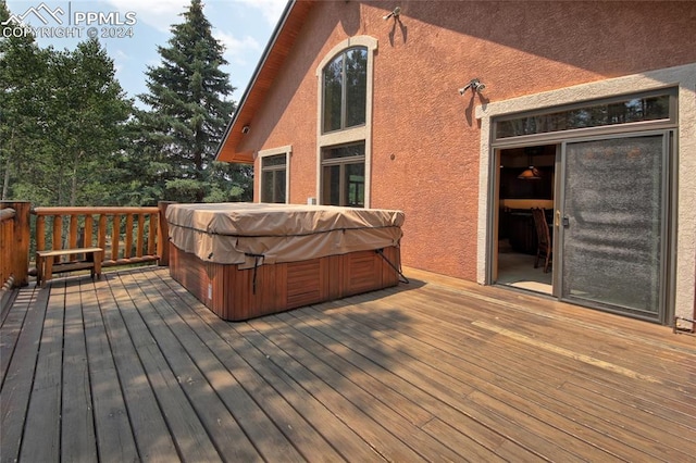 deck with a hot tub