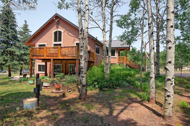 rear view of house with a deck