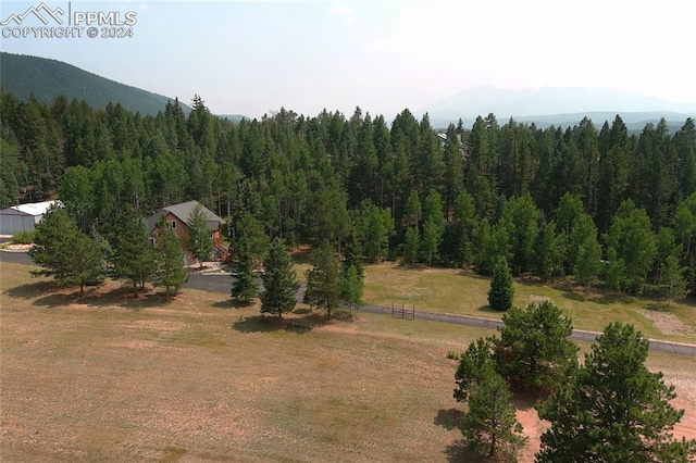 drone / aerial view with a mountain view and a rural view