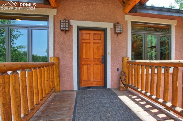 doorway to property with a porch