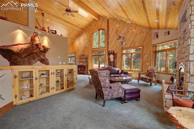 living room with ceiling fan, beam ceiling, wooden ceiling, and high vaulted ceiling