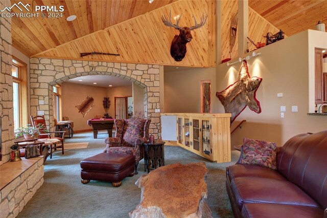 carpeted living room featuring high vaulted ceiling, wood ceiling, and pool table