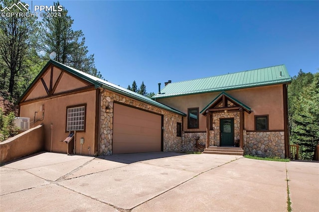 view of front of property with a garage