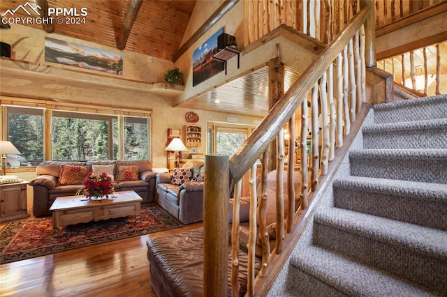 living room with hardwood / wood-style flooring, wood ceiling, high vaulted ceiling, and plenty of natural light