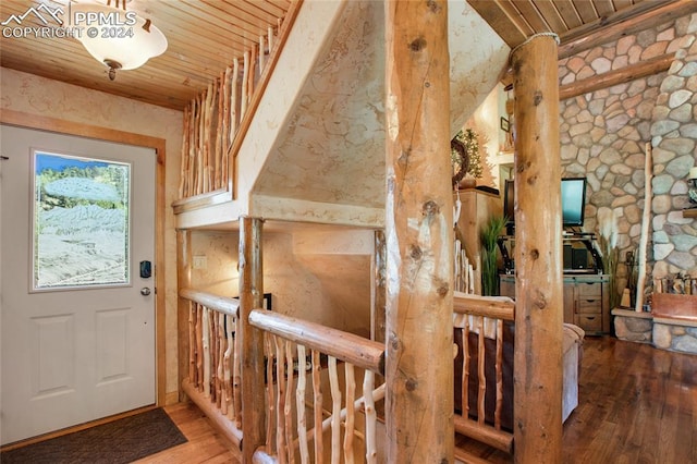 entrance foyer with hardwood / wood-style flooring and wood ceiling