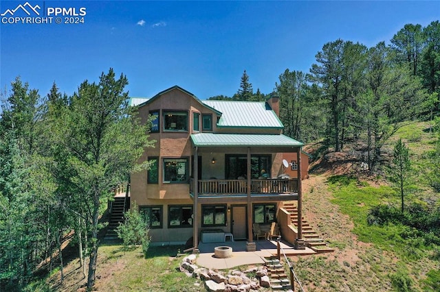 back of property featuring a patio area